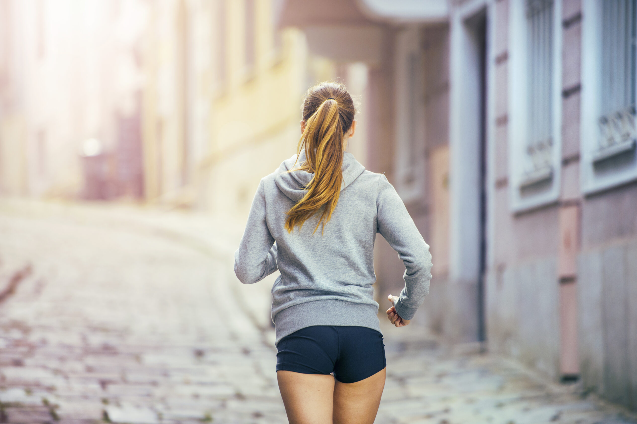 graphicstock-young-female-runner-is-jogging-on-tiled-pavement-old-city-on-center-healthy-lifestyle_r0eeUjb3bb-scaled Ditch the Fad Diets! 5 Effective and Safe Ways to Lose Weight