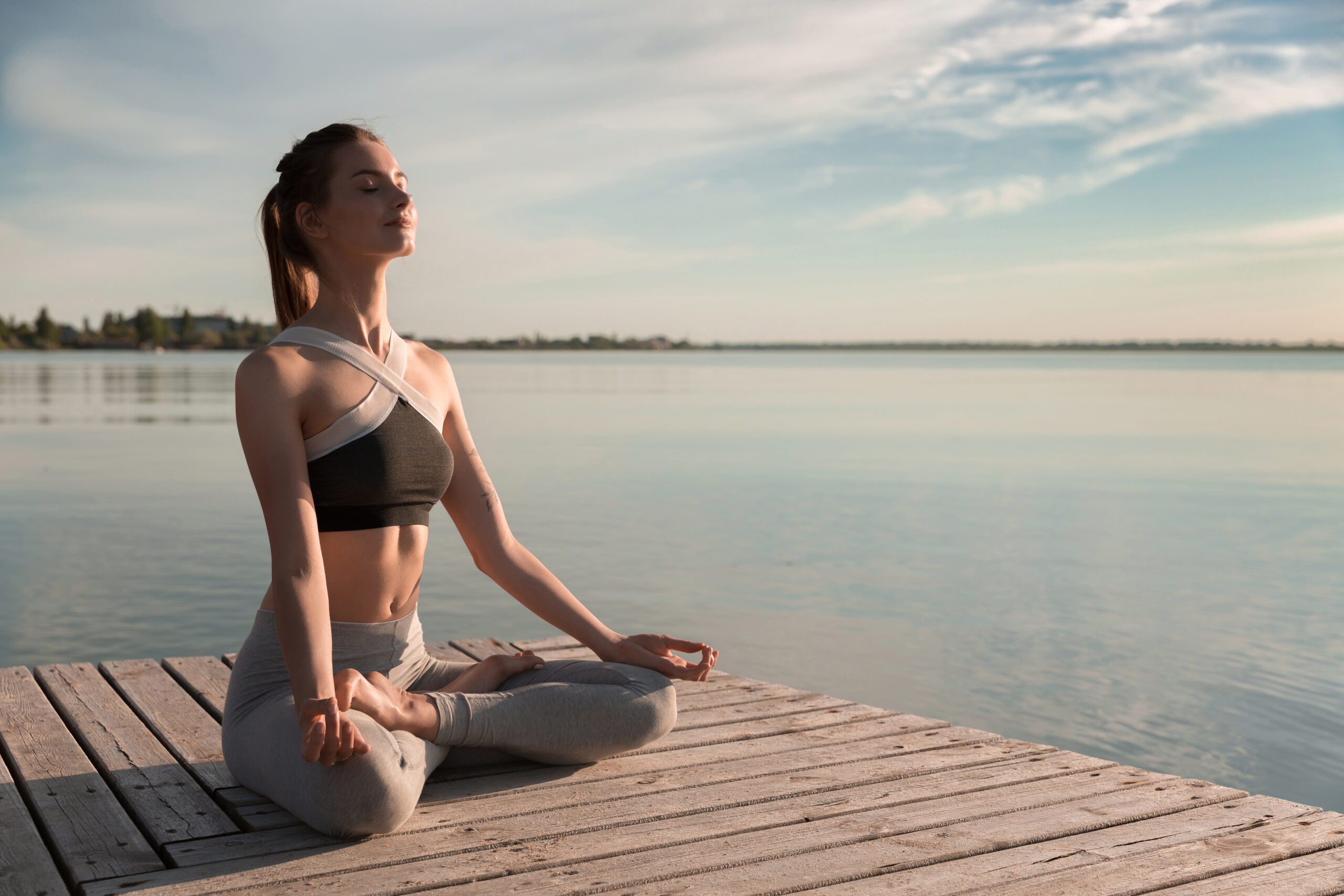 storyblocks-image-of-young-sports-lady-at-the-beach-make-meditation-exercises_rAnSBnpcZ-scaled Ditch the Fad Diets: 5 Proven Ways to Lose Weight Safely