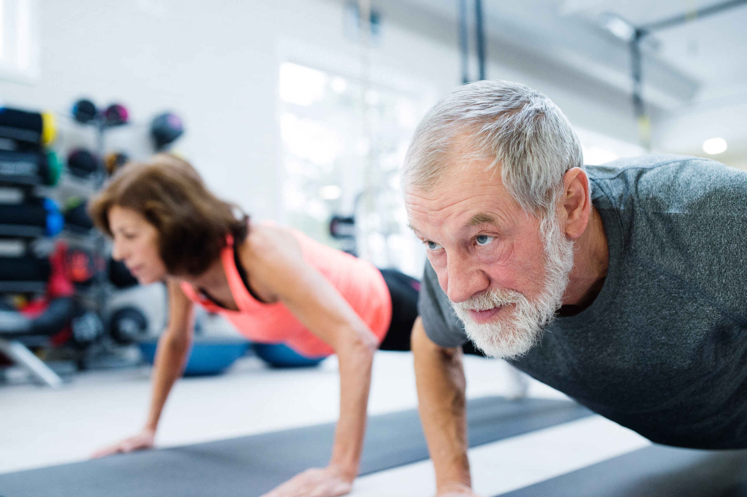 graphicstock-beautiful-fit-senior-couple-in-gym-working-out-doing-push-ups_S_fyZzY8G--scaled Exercise Your Way to a Healthier, Fitter You: The Best Worko...